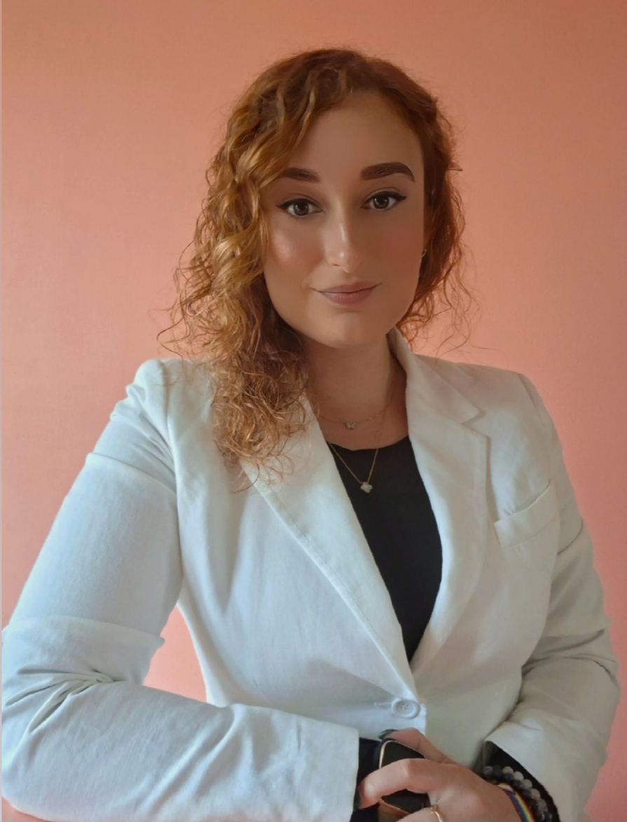 Mirela Curiman, fractional CMO and global marketing leader, in a white blazer